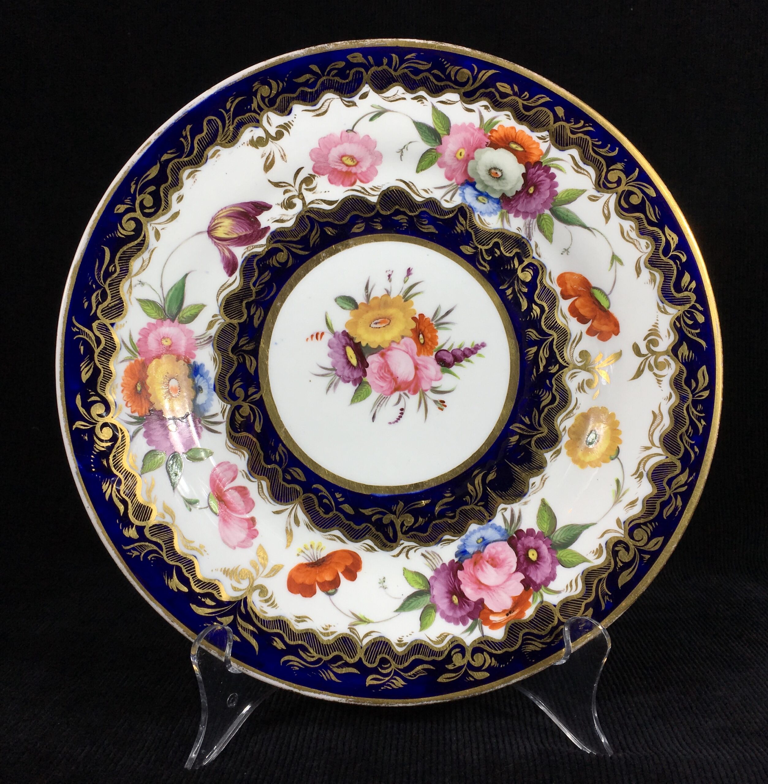 Coalport plate, rich flower decoration within blue bands, C.1825.-0