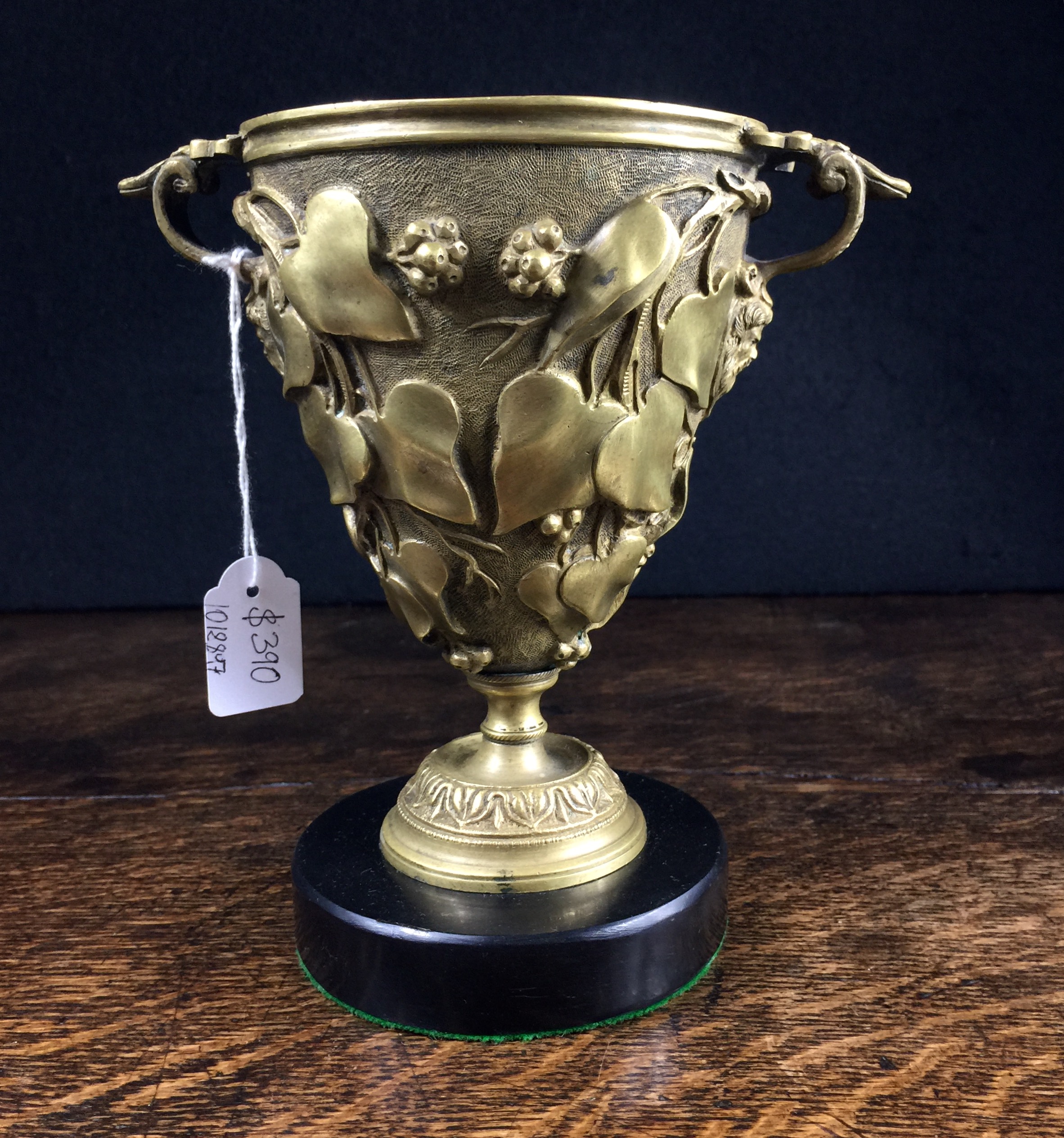 Ormolu urn on black marble plinth, Bacchus heads & ivy, circa 1825-0