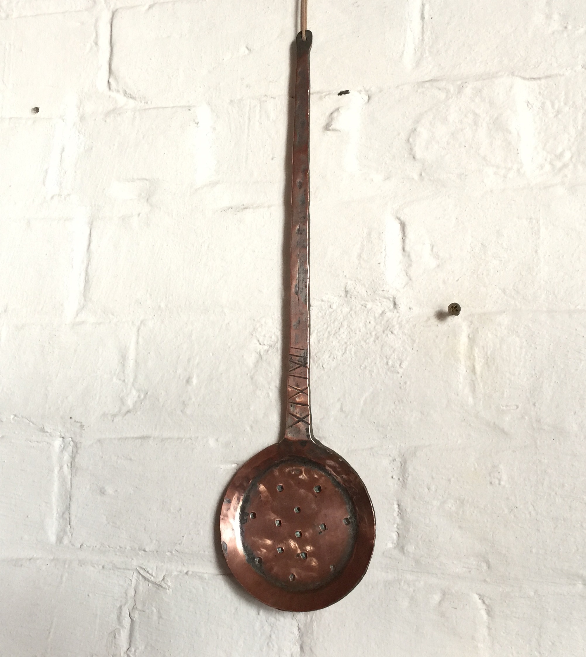 Middle Eastern solid copper skimmer, X design to handle, 19th century -0