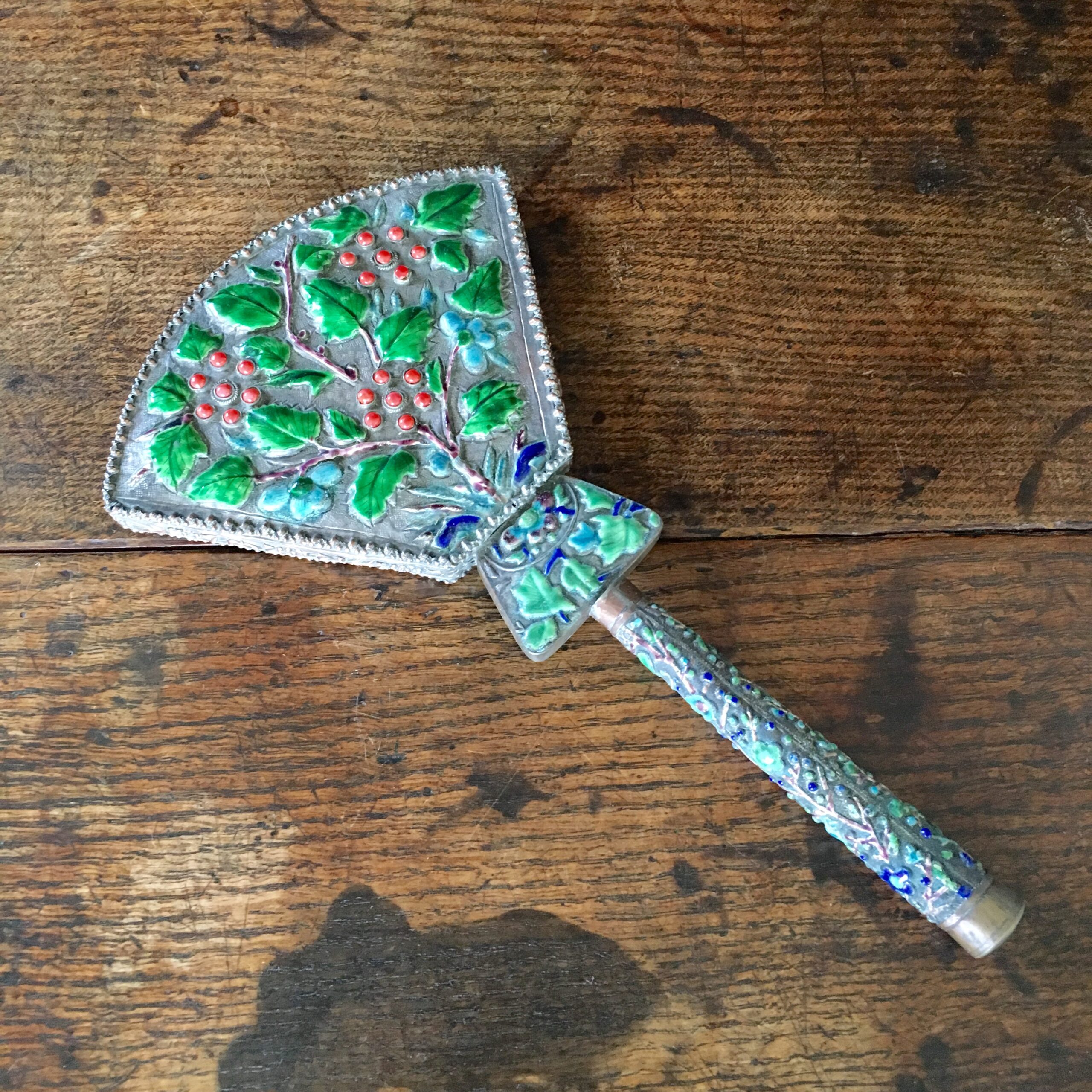 Chinese hand mirror with embossed enamel leaves & coral inset flowers, c. 1920’s -0