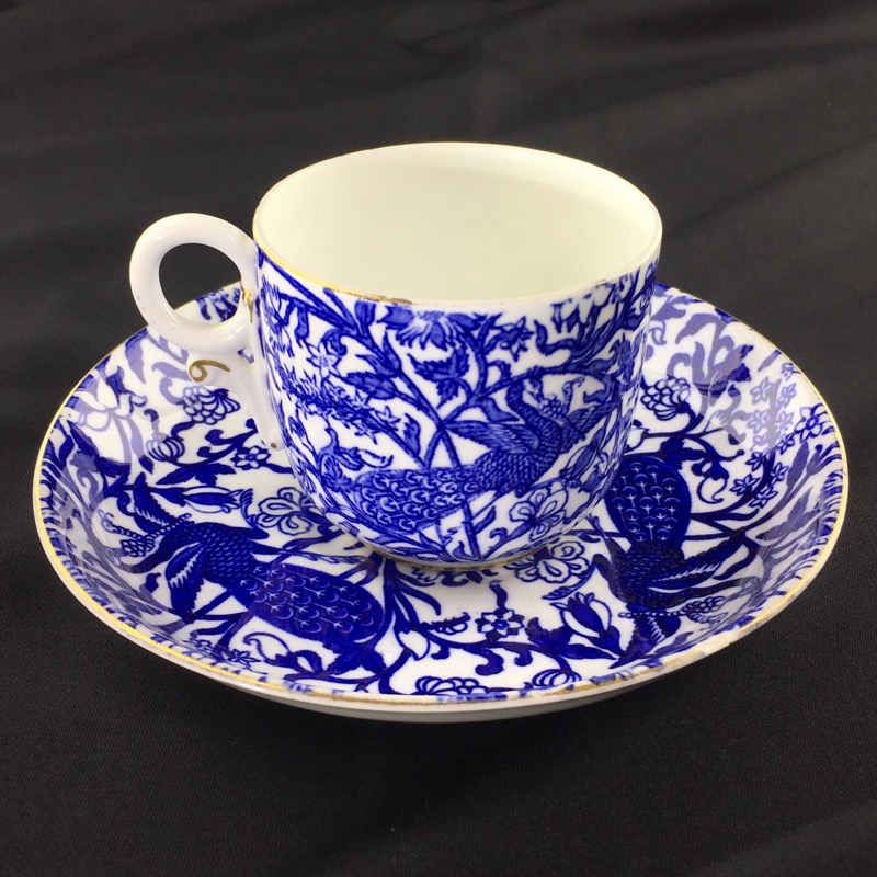 Royal Crown Derby cup and saucer , blue peacocks, dated 1897 & 1924-0