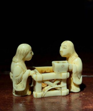 Japanese Ivory carving, two figures with a crate, c. 1890. -0