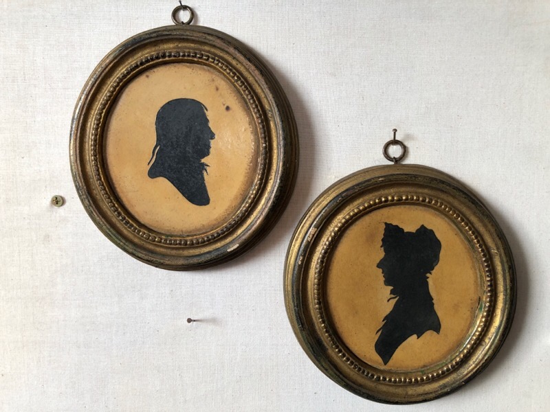 Pair of paper silhouettes on original plaster mount, 20th century -0