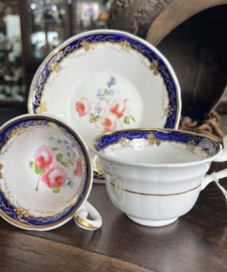 English porcelain trio, blue border and flower sprigs c.1830