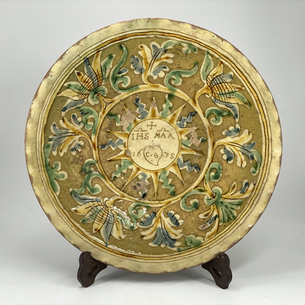 Italian dated pottery charger, Squillache type with sgraffito baroque flowers...