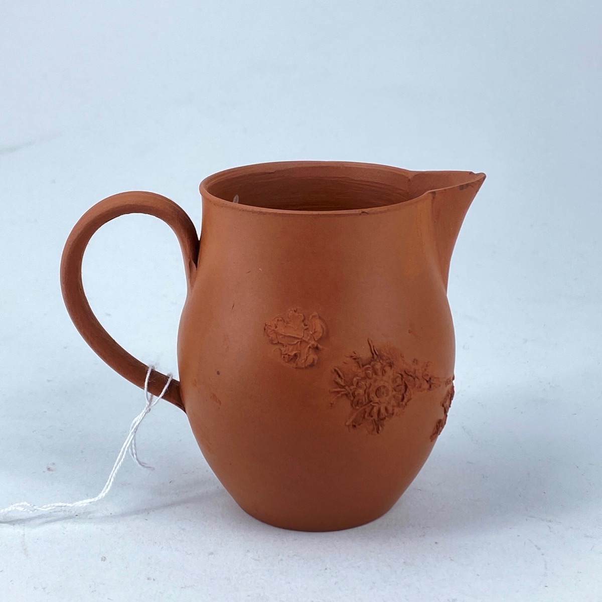 Staffordshire redware milk jug , flower & scroll sprigs, c. 1770