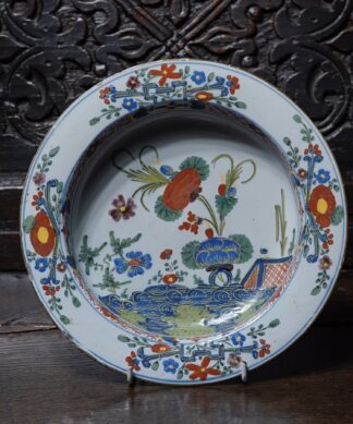 Italian tinglaze bowl with garden scene in colour, C. 1750