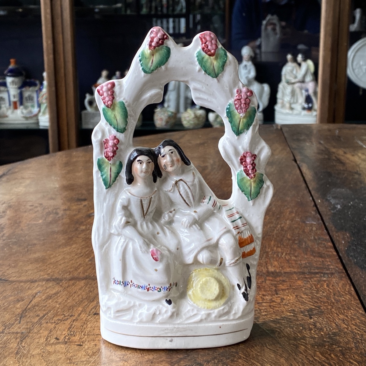 Staffordshire group of a couple in a grape arbor, c. 1860