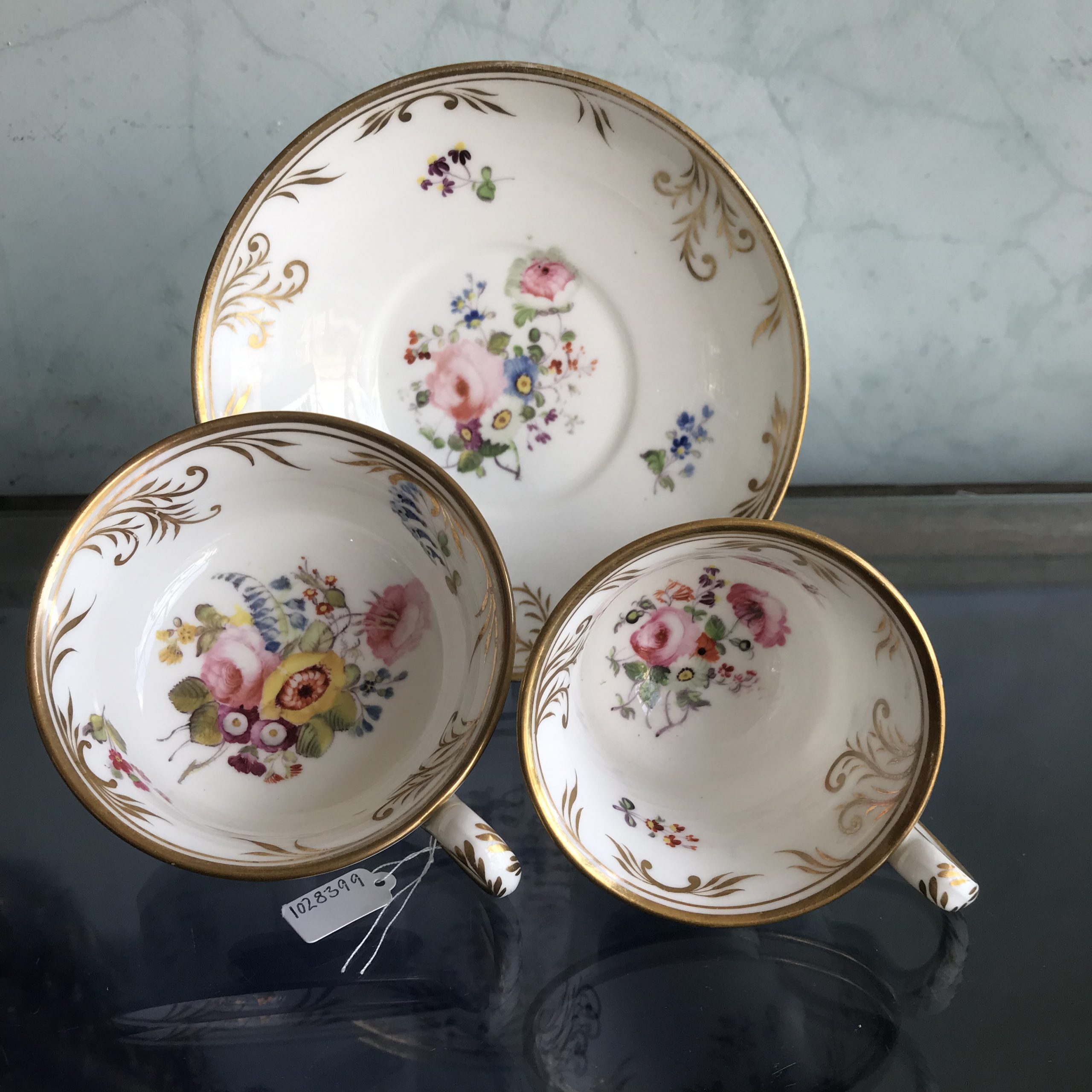 Minton French shape trio with hand painted flowers and gilt vine rims, c.1835