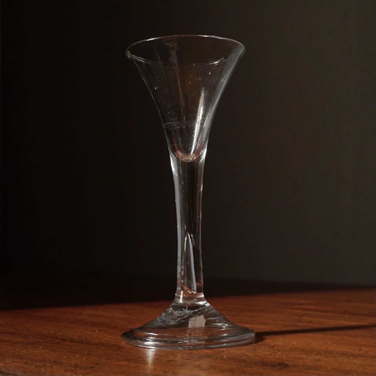 Fine Georgian glass with large bubble in plain stem, domed foot, c.1755