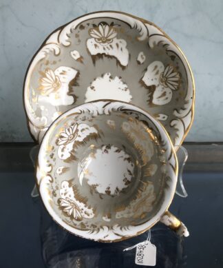 Rockingham cup & saucer, gilt flowerhead pattern on grey ground, c.1835.