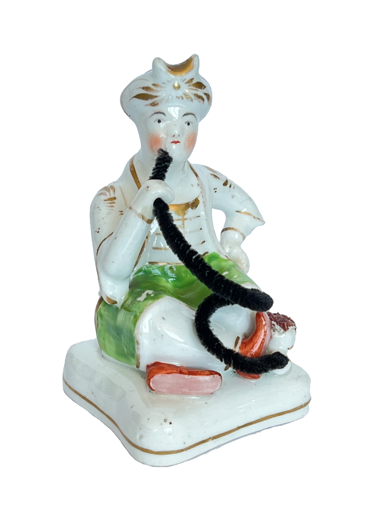 Staffordshire porcelain figure of a seated Turk, c.1835