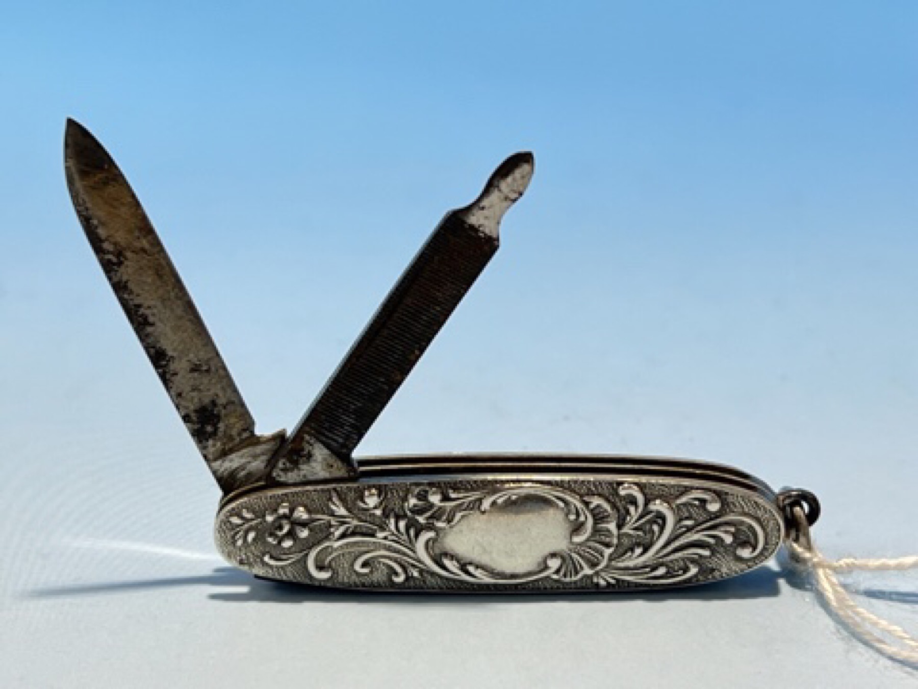 French silver pocket knife/nail file with rococo scrolls, c.1900