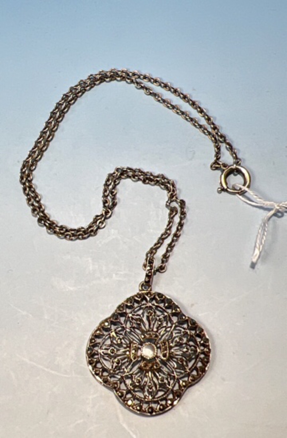 French silver marcasite and mother of pearl filigree pendant on chain, c.1920