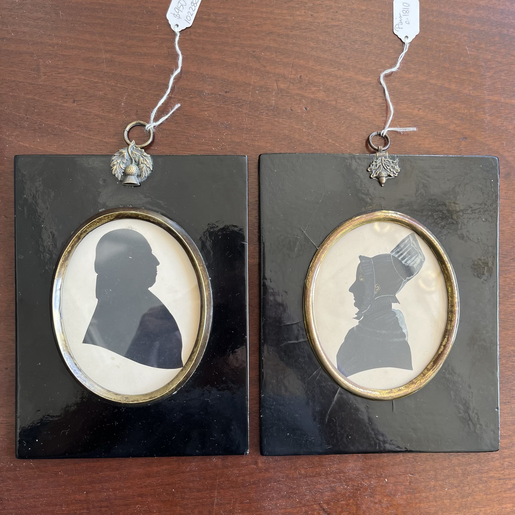 Pair of large Georgian silhouettes, lady & gent, black lacquer frames, c. 1825