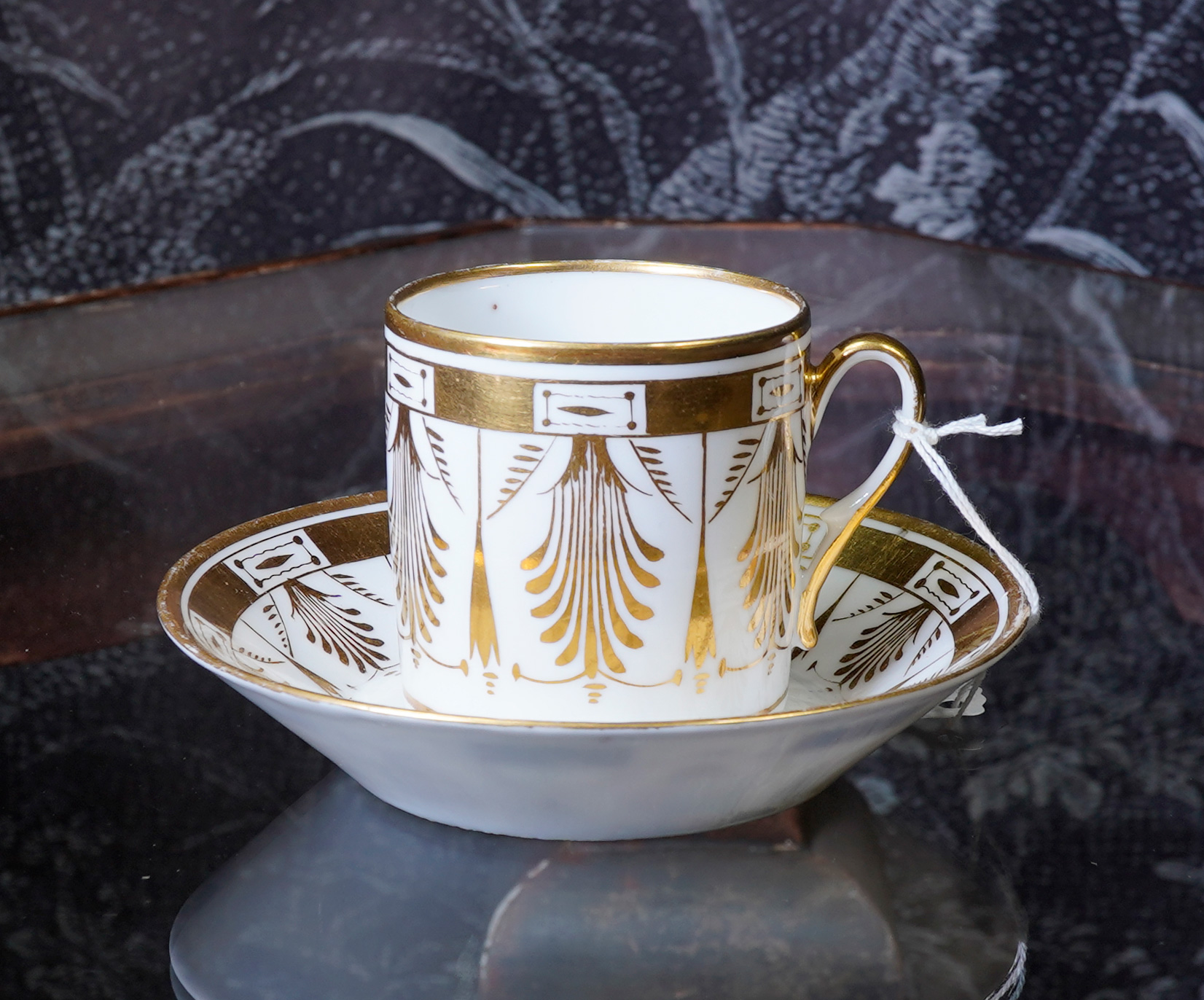 Paris porcelain coffee can & saucer, Anthemion gilt pattern, c. 1810