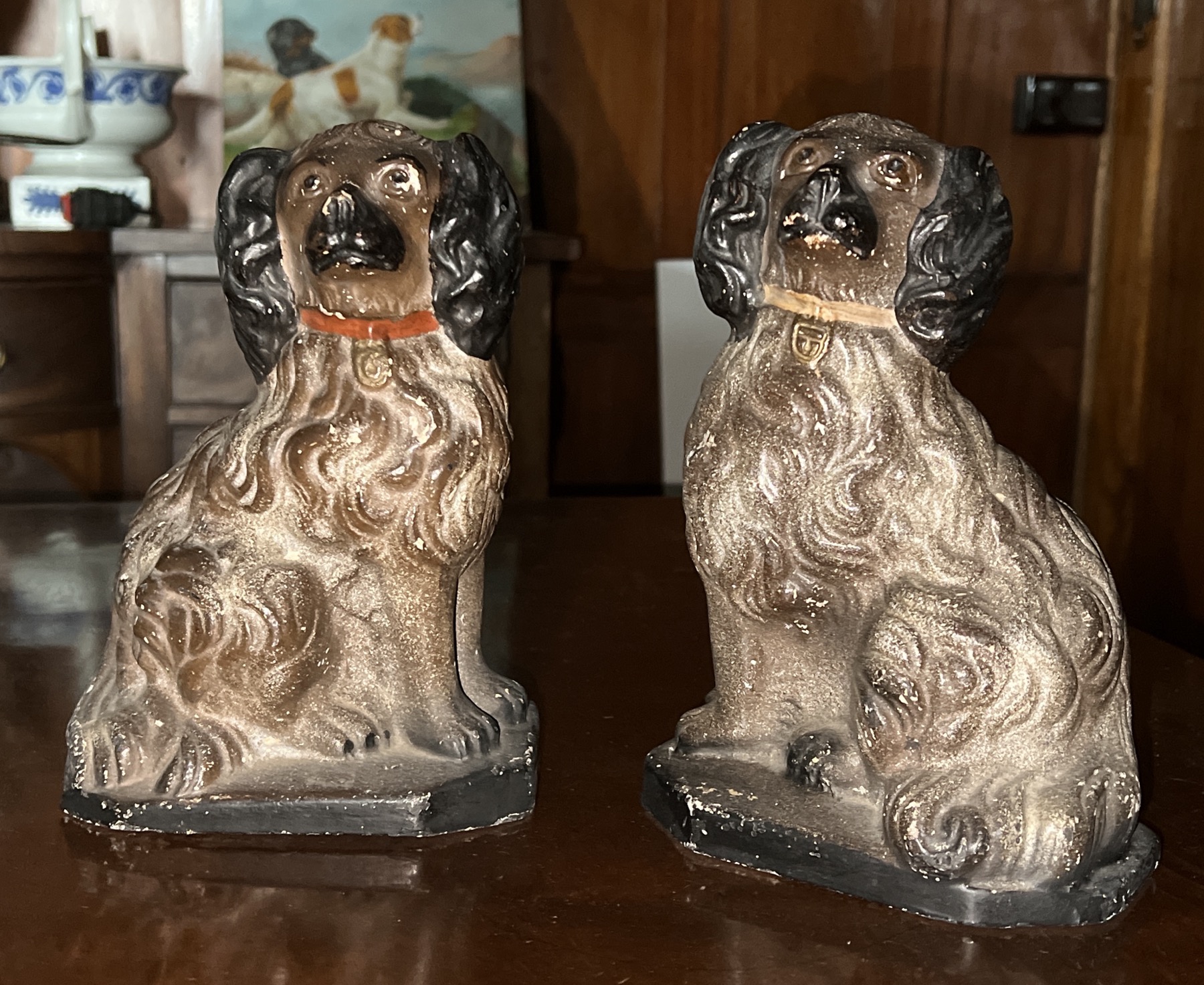 Chalkware pair of staffordshire style spaniels with red & beige collars, c.1880