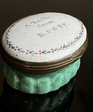 English enamel patch box, 'Trifle from Rugby' with green base, c. 1800