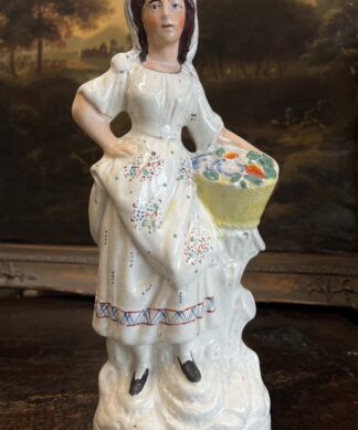 Large Staffordshire figure, Girl with basket of flowers, c. 1870