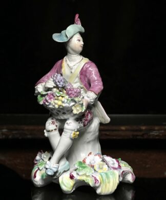 Rare Derby 'Pale Family' figure of 'Summer', man with basket of grapes, 1756-9