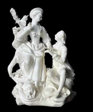 Beautiful biscuit porcelain model , 'Pastoral Group with dog', with a gallant seated on a pile of rocks interacting with a standing bareheaded lady, a tree in the background, the reverse with a seated goat.   Inscribed ‘N72’, also modeller’s mark ‘K’      Circa 1790 