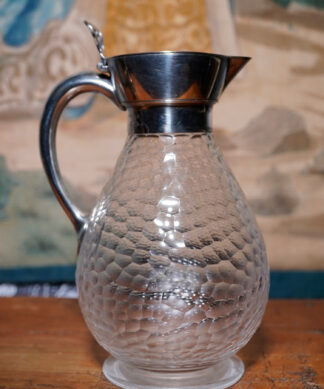 Glass claret jug with silver handle and spout, C.1885