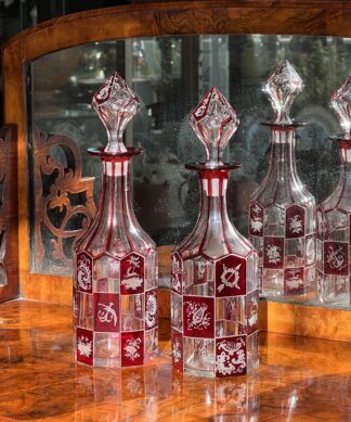 Pair of Bohemian ruby engraved perfume decanters, circa 1870