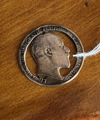 Edward VII Sterling Silver medallion with cut-out head, schilling c.