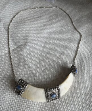 Indo- Tibetan boar tusk pendant with silver mounts, earlier 20th c.