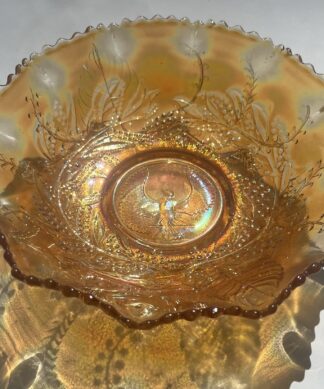 Large carnival marigold glass bowl, piping shrike bird C.1900