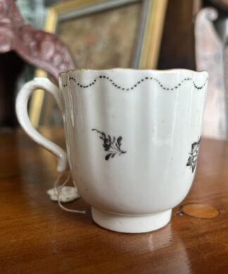 Caughley fluted coffee cup, oriental flowers in black, c. 1780