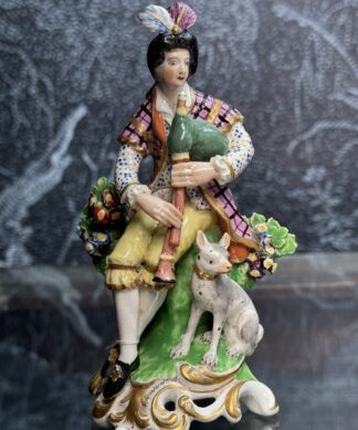 Derby figure of a piping shepherd + dog, c. 1785