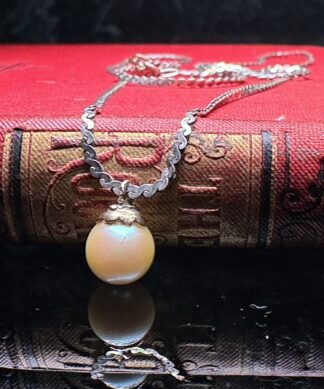 Sterling Silver Necklace with golden pearl drop, 20th c.