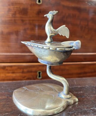 Indian brass Temple oil lamp on leaf-form stand, bird knop, Ceylon c. 1920