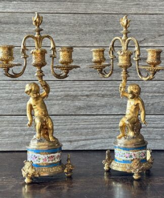 Pair of French Ormolu 'cupid' candlesticks, circa 1870