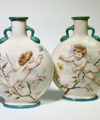 Pair of Minton's Art Studio ‘Moon Flasks’, E.J. Strutt decorated with cherubs, 1873