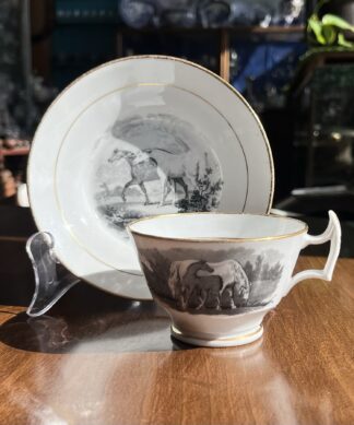 Newhall cup & saucer with black bat print of horses & stag, c. 1820