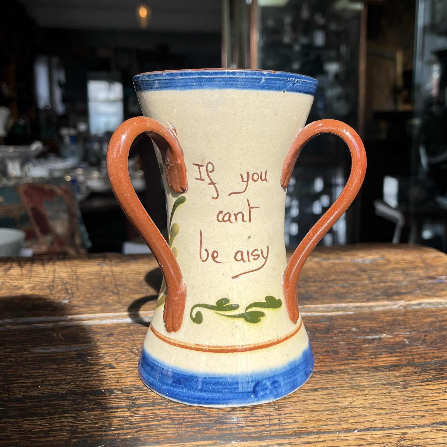 Torquay Aller Vale Pottery 3-handled vase, 'If you can't be aisy', c. 1910