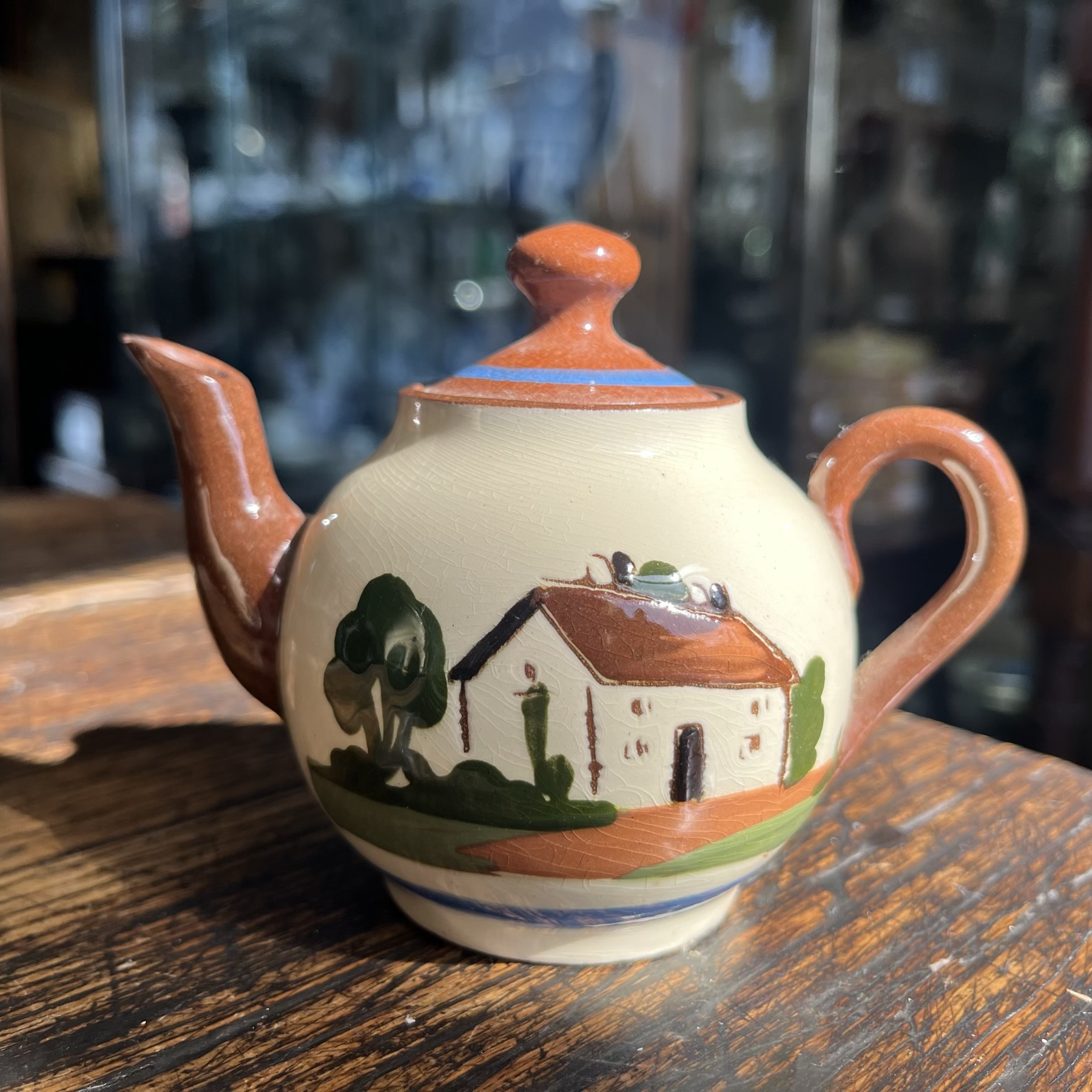 Torquay Watcombe Pottery mini souvenir teapot, Knaresborough Chemist, mid 20th c.