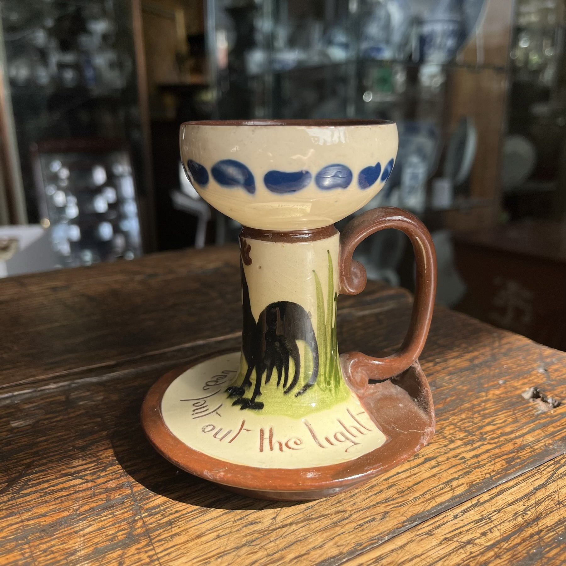 Torquay Longpark Pottery chamber candlestick, Rooster, 'Last in Bed' motto ware, c. 1920's