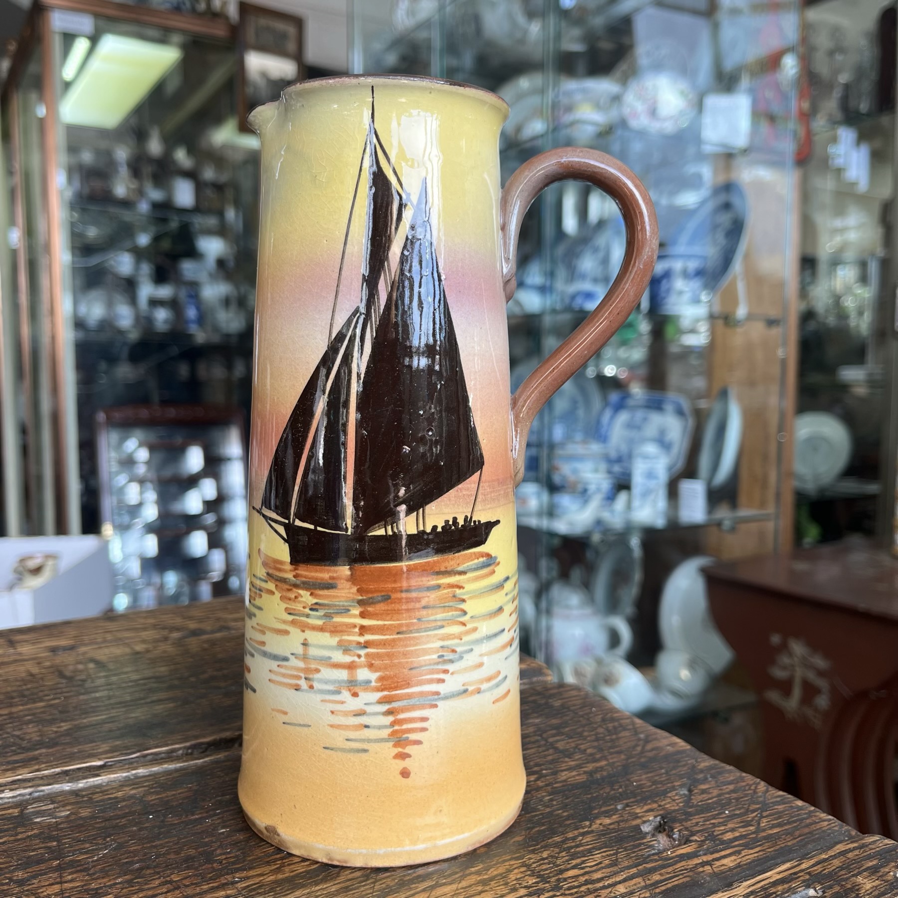 Watcombe Torquay Pottery jug, hand-painted Sunset Boats, earlier 20th c.