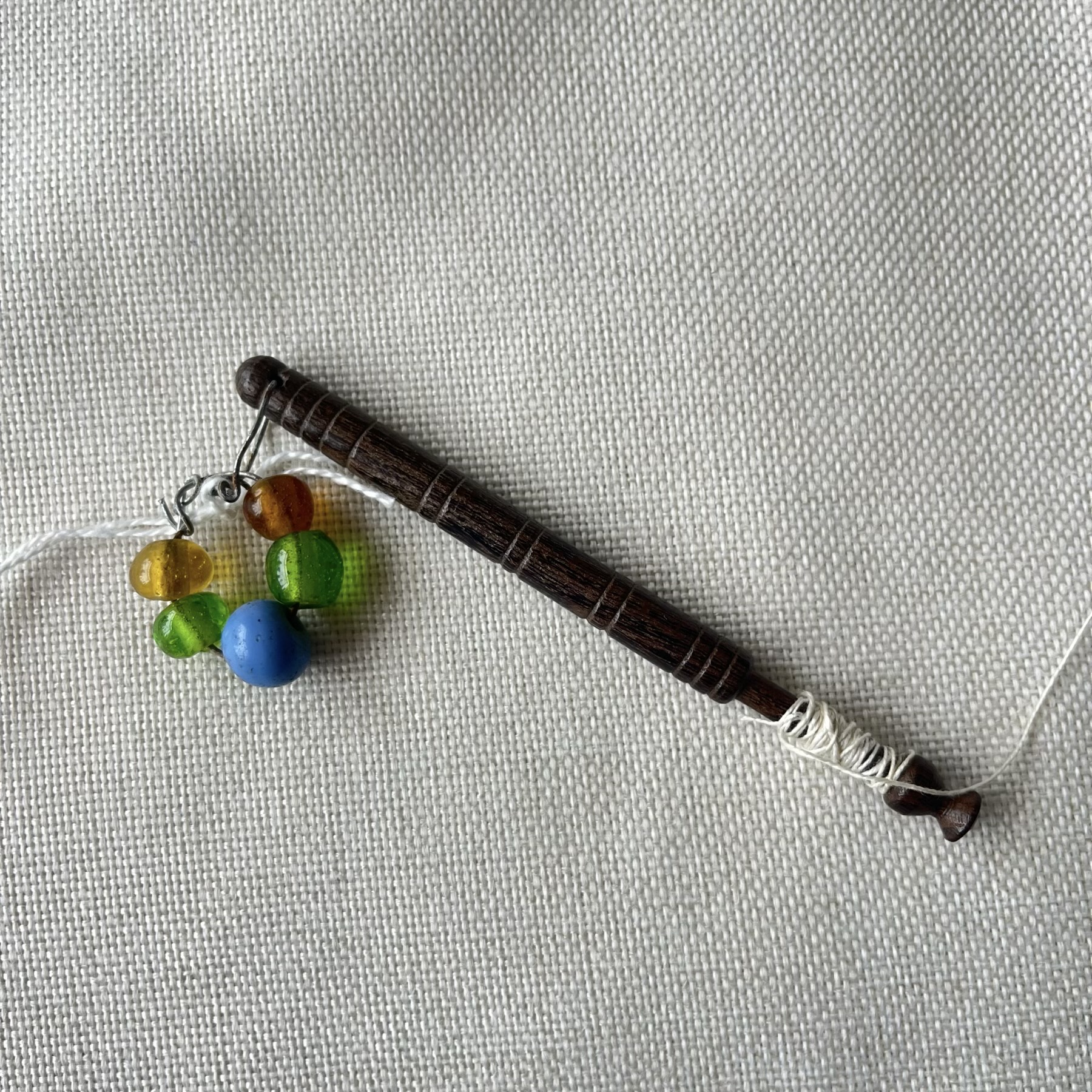 Late Victorian turned wood lace bobbin with hand blown beads C. 1900