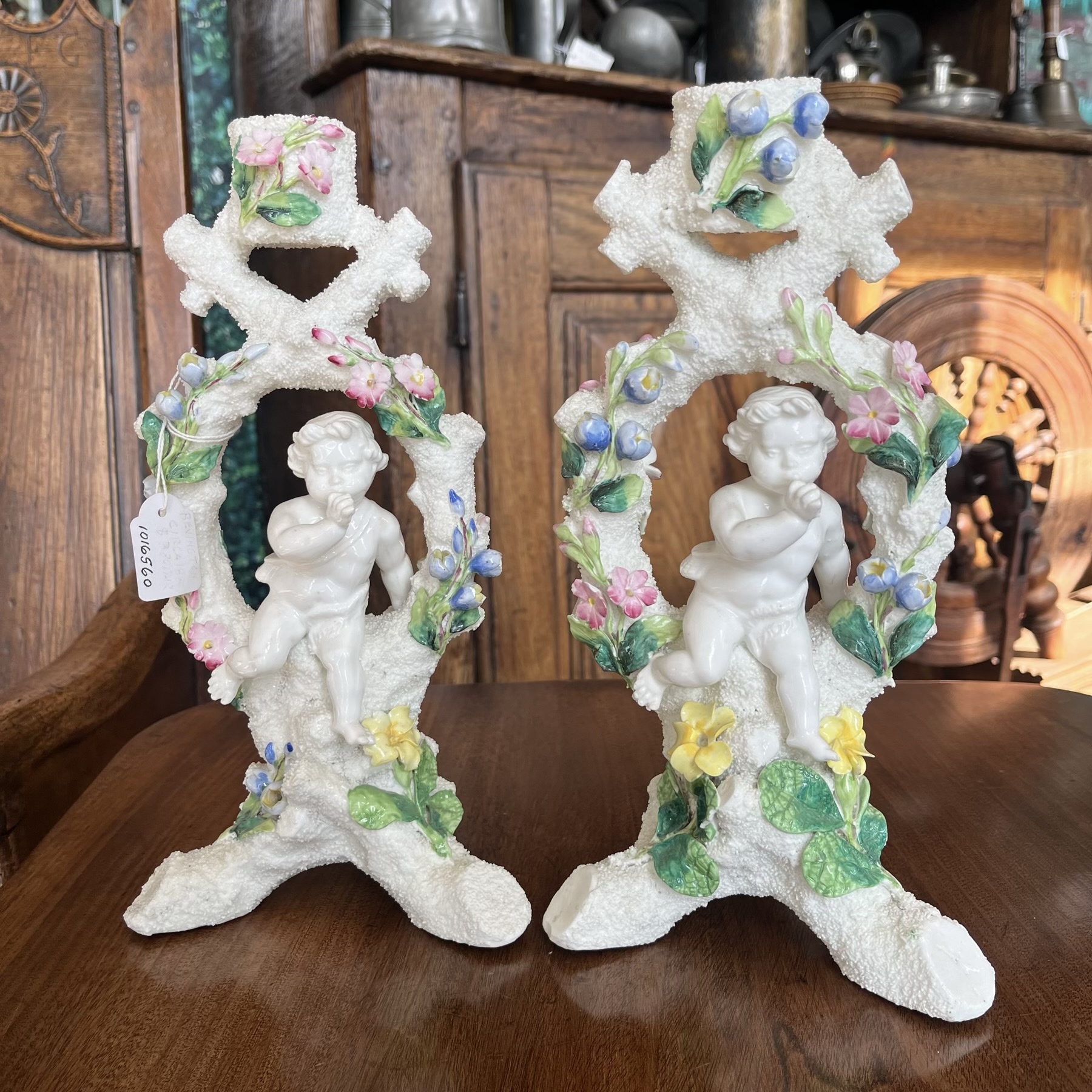 Pair of Bevington candlesticks with cherubs,  c.1880.