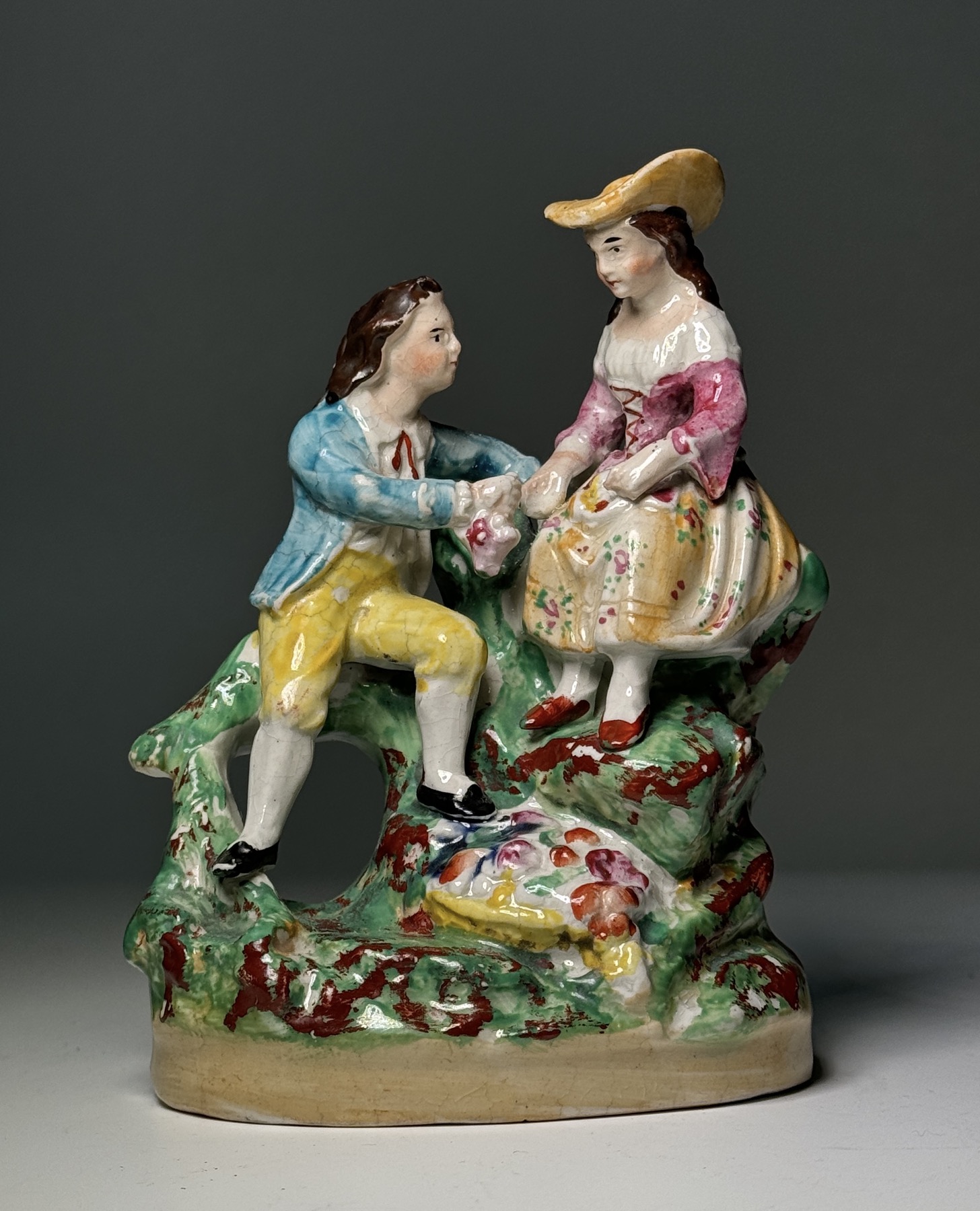 Staffordshire pottery group, lad & lass with flowers, attr. Dudson c. 1845