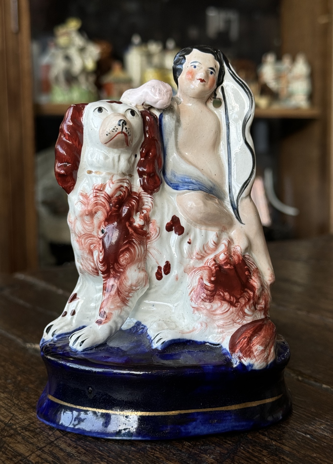 Staffordshire Spaniel with Cupid figure, unusual, c. 1850