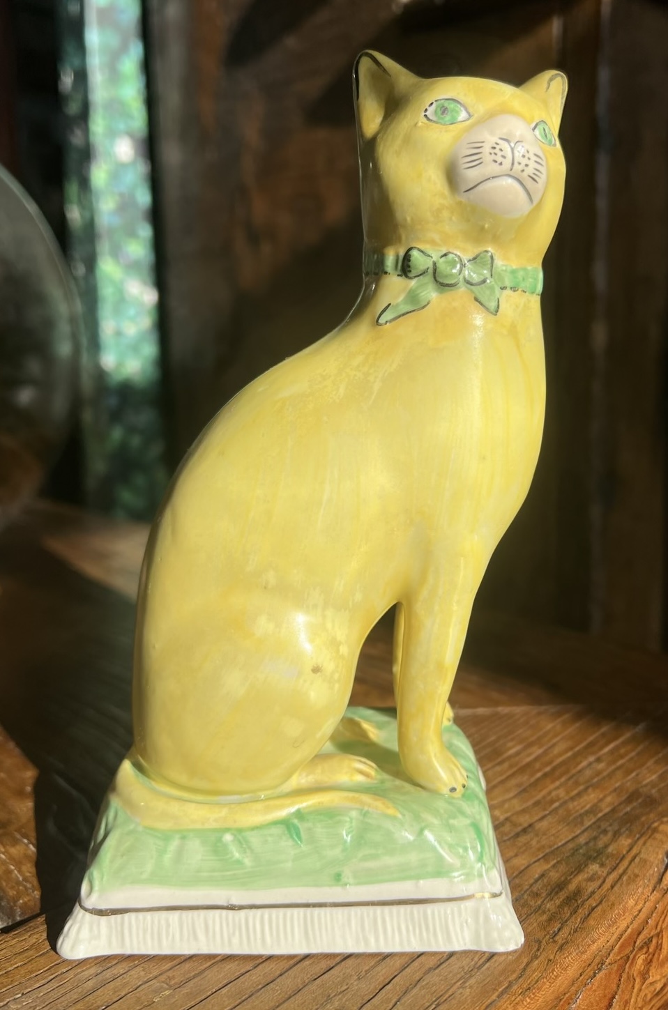 Staffordshire  pottery  cat , painted in yellow, early 20th C