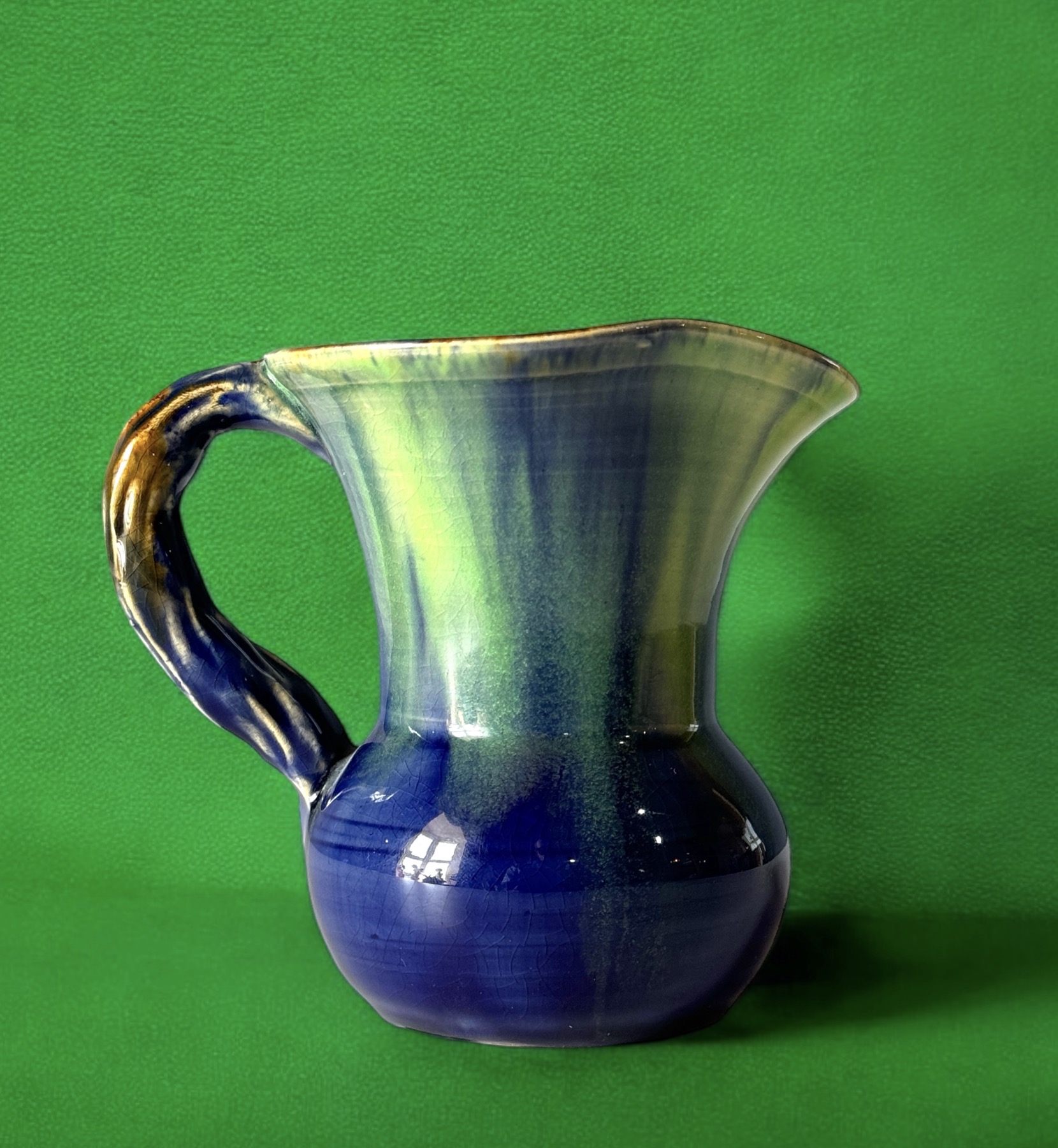 Remued Australian Pottery jug with gum-branch handle, c. 1930