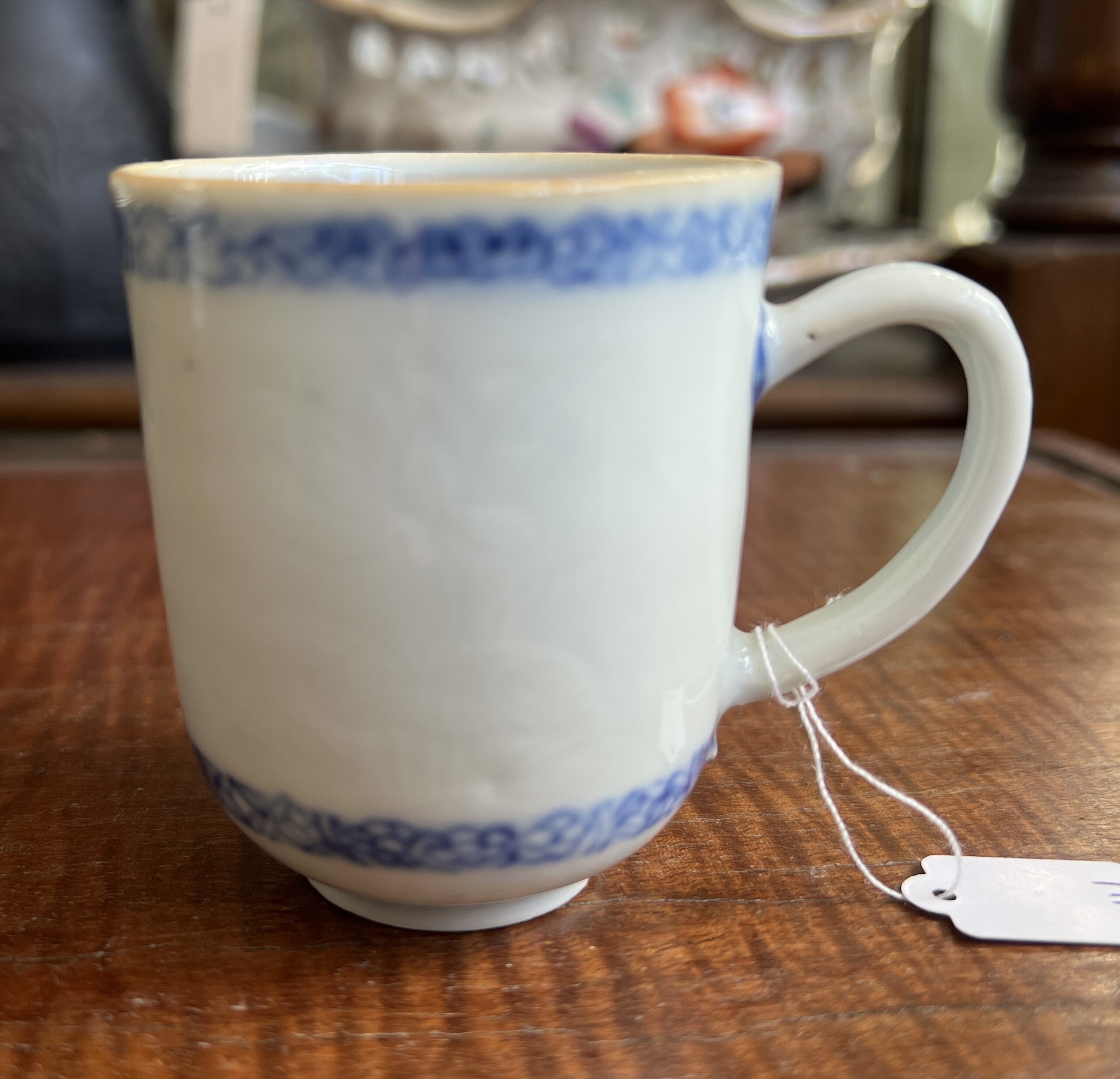 Chinese coffee cup with incised flowers, underglaze border, c. 1760